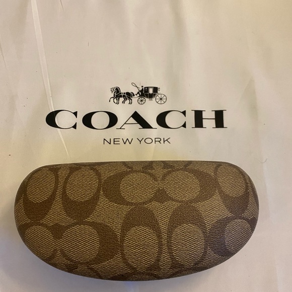 Coach Brown Sunglasses Case with Signature C print and cleaning cloth.